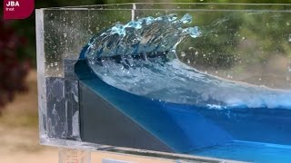 Wave tank demonstration showing the impact of coastal defences on flood risk [upl. by Delcine]