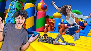 STAYING OVERNIGHT IN A GIANT BOUNCY HOUSE 24 hour challenge [upl. by Houghton638]