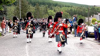 Massed pipes amp drums parade through town to the 2019 Ballater Highland Games in Scotland [upl. by Aidin]