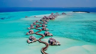 Maldives 4K  Beautiful relaxing music  surreal drone footage [upl. by Alenairam634]