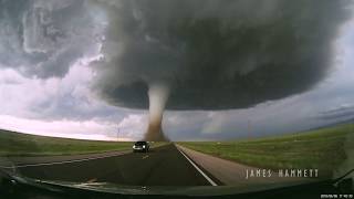 Storm chasing dashcam Tornado crossing the highway Laramie Wyoming [upl. by Marylou]