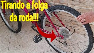 Como tirar folga da roda da bicicleta [upl. by Nnylirehs]